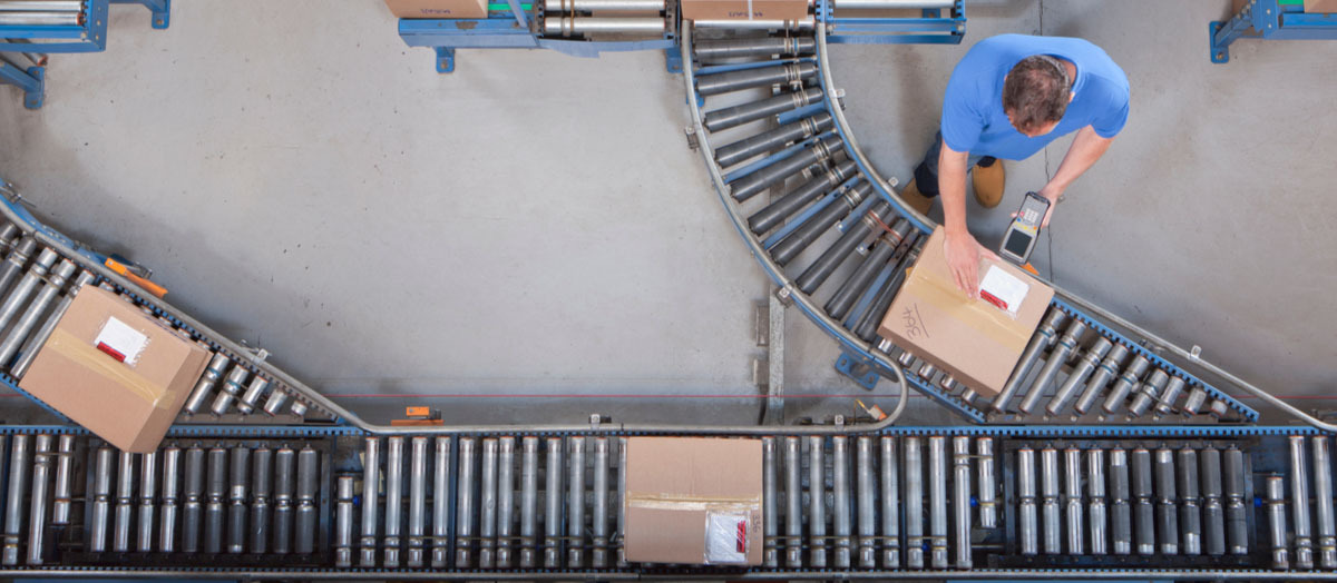 Worker Labeling Boxes on a Demanding Assembly Line