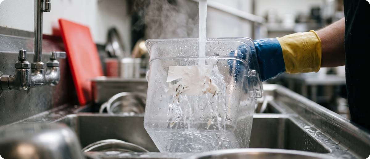 dissolvable food labels Dissolvable label washing off a food storage container under running water